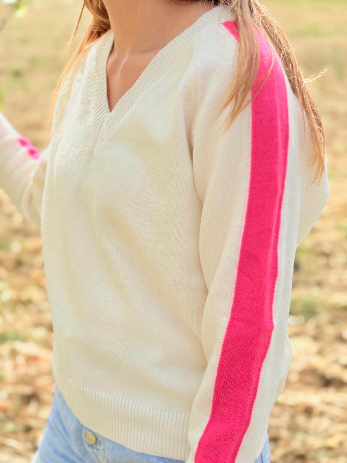 Pull femme blanc avec bande rose sur la manche