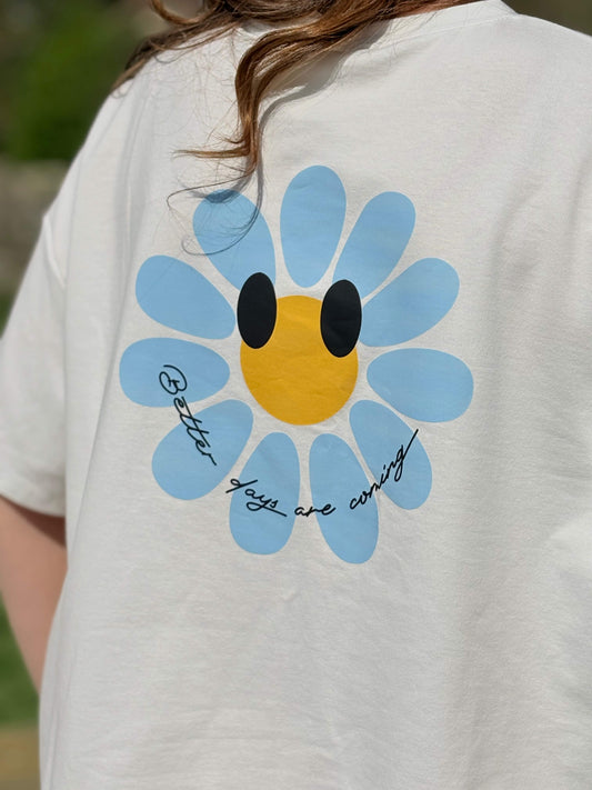 Fleur bleue avec message "Better days are coming"